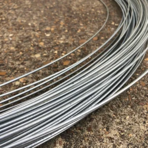Curved metal rods arranged on a rough surface.