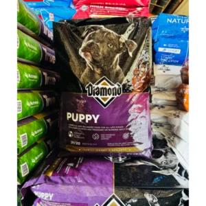 Bag of Diamond Naturals puppy food on a store shelf.