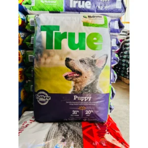 Bag of True brand puppy food with a dog image.