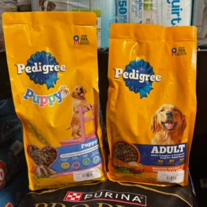 Two bags of Pedigree dog food, one for puppies and one for adult dogs.