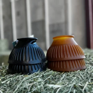 Two decorative lampshades with intricate designs on a textured surface.