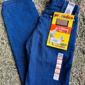 Pair of blue denim jeans with original price tags attached.