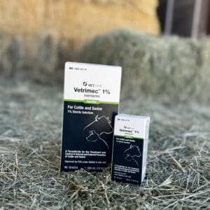 Two boxes of veterinary medication placed on hay.