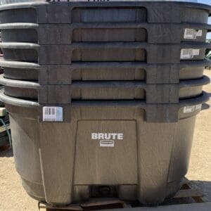 Large black Brute waste container with a label on the side.